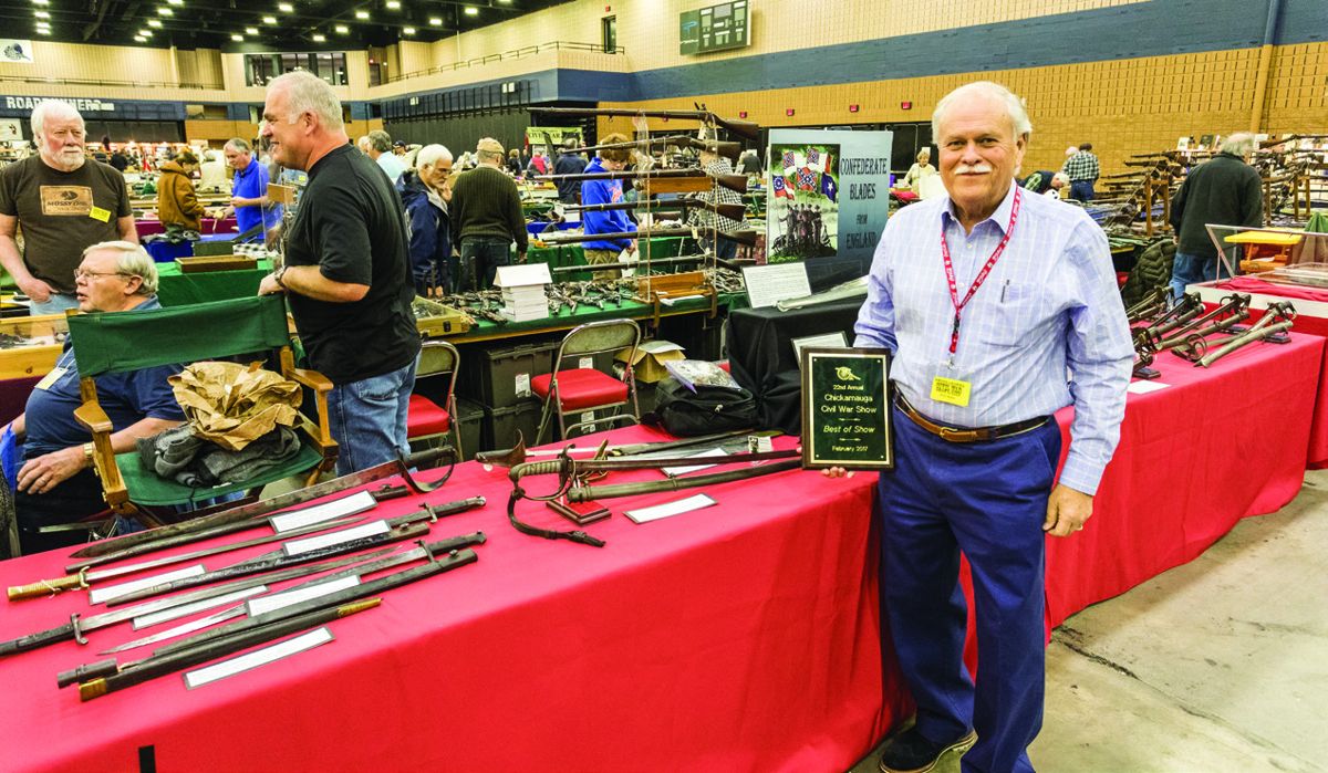 Dave Winfield standing in front of his Best Of Show display of English weapons imported by the Confederacy.