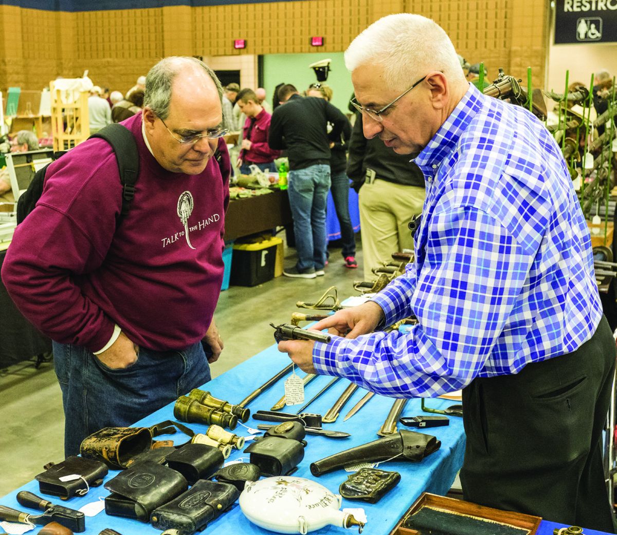 Firearms dealer Vin Caponi helps Scott Anderson with advice on buying antique weapons.