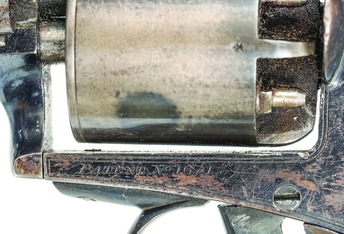 Close up view of the serial number marking on #1671. This example has a case-hardened cylinder. On this revolver the cylinder chambers are not numbered.