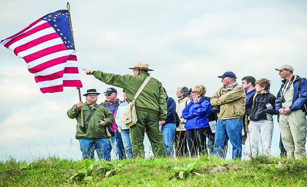 Battlefield tours often “walk in the footsteps” of the soldiers themselves. This group, led by ranger Jeff Driscoll, is following two Union regiments at Cedar Creek. Each visitor also is assigned the name of an individual soldier and learns of their fate at the end of the program.