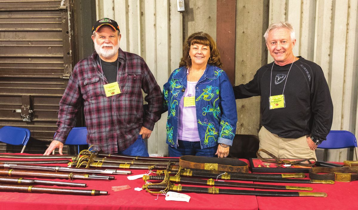 Dicky & Teresa Ferry, owners of Richard Ferry Military Antiques, Macclenny, Fla., with Wallace Markert owner of CS Acquisitions, Dewitt, Va.