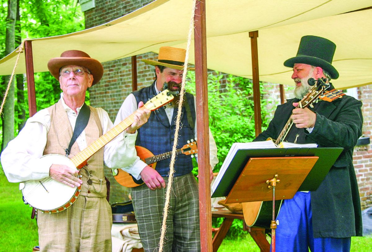 Rich Mendoza, Brian Ross, and John Suchernick, of the Libby Prison Minstrels, entertain visitors outside the Foreman’s (Christopher C. Wantuck)