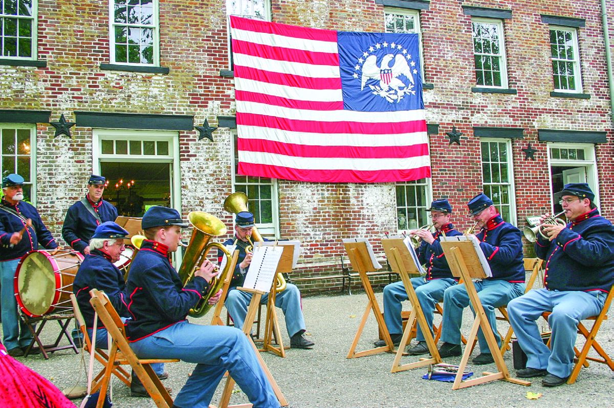 The Fort Delaware Cornet Band entertains visitors to the Village’s General Store. (Christopher C. Wantuck)