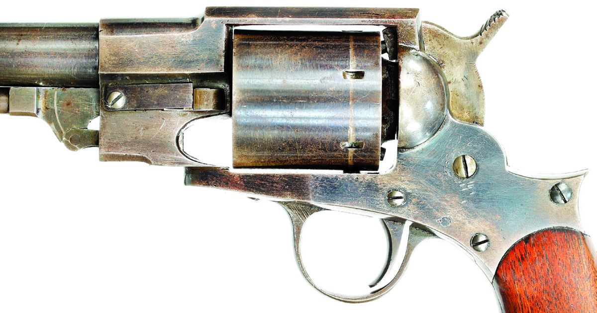 Close up showing the spring that retains the arbor pin and the wing shaped extension of the pin.