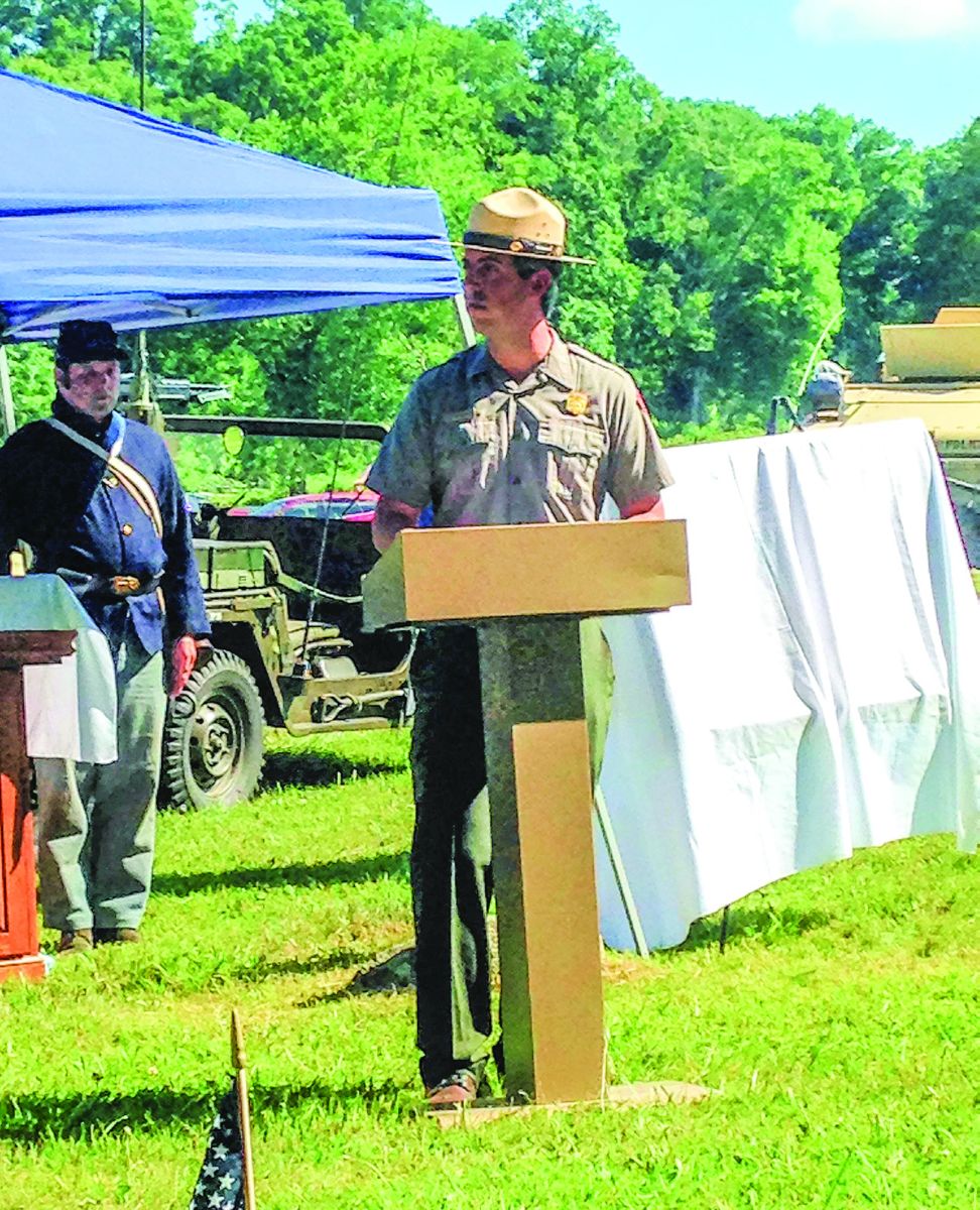 NPS Ranger Chris Gwinn addresses the crowd of over 200 who gathered for the rededication. (All photos by Ron Nori)