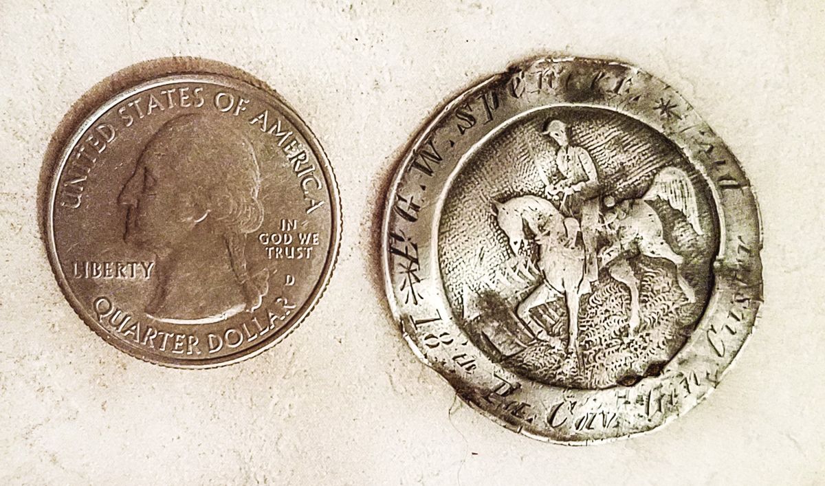 Quarter to the left of the I.D. pin for scale.