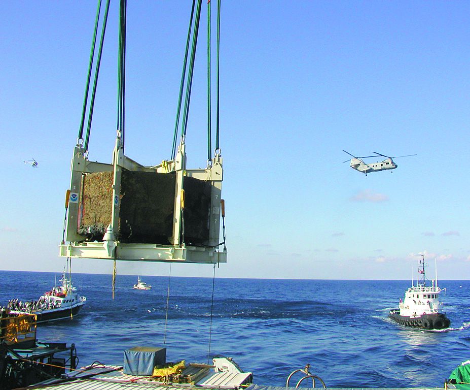 Monitor’s turret lifted from the wreck site in 2002. (The Mariners’ Museum and Park/ National Oceanic and Atmospheric Administration.)
