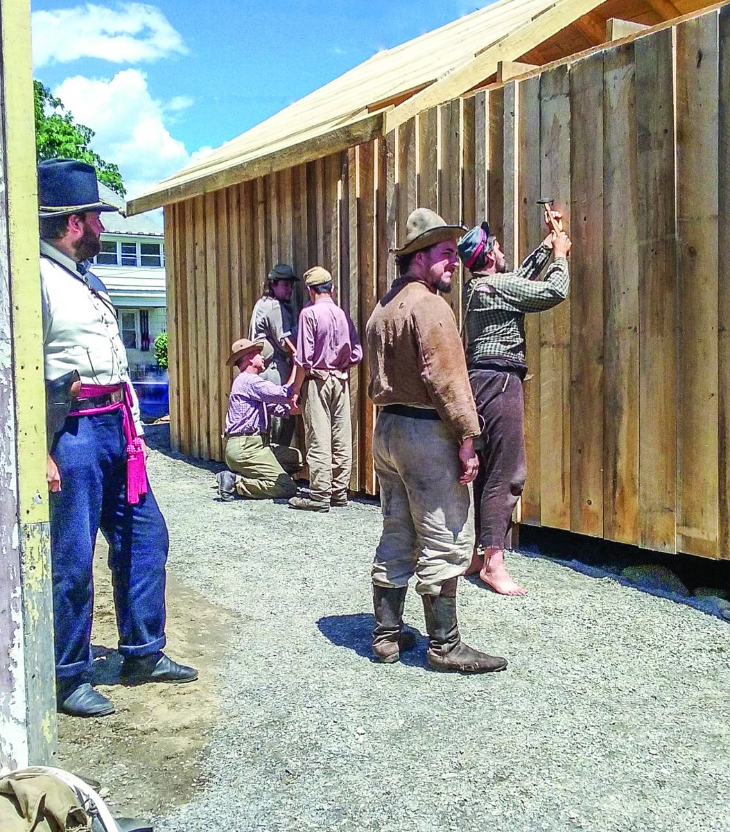 Prisoners Building Barracks Under Supervision. (Terri Olszowy)