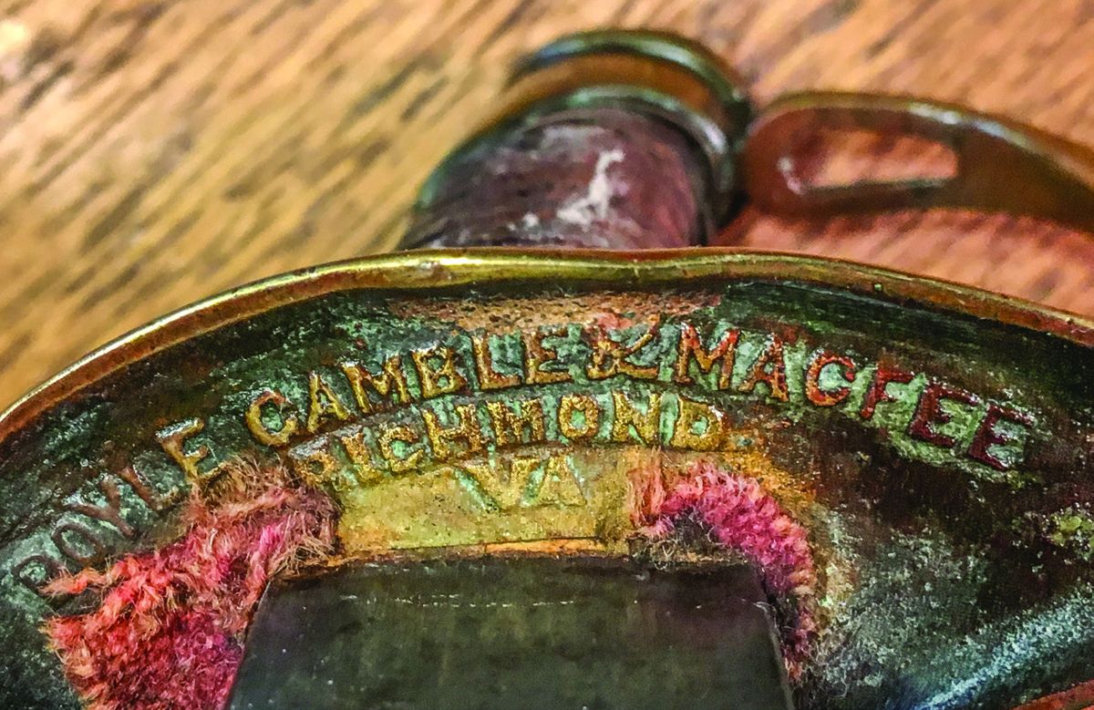 Only about half the foot officer swords from this manufacturer had the raised relief cast mark seen here. Remnants of the red dyed cloth protective washer typical of this manufacturer are still present.