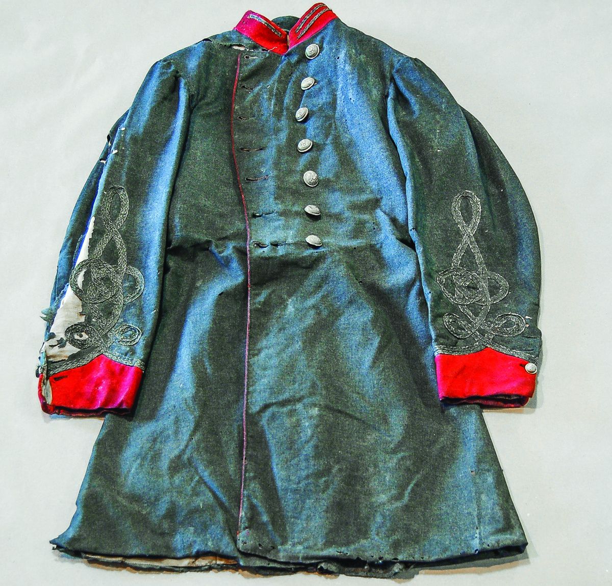 Coat, front, before conservation.