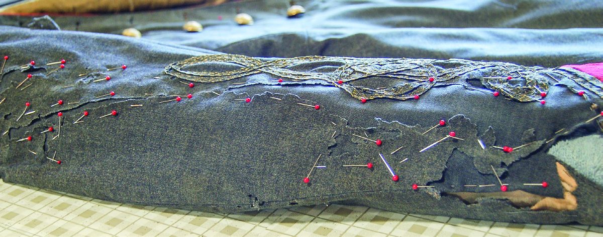 Underlay patch pinned into the missing area of the sleeve.