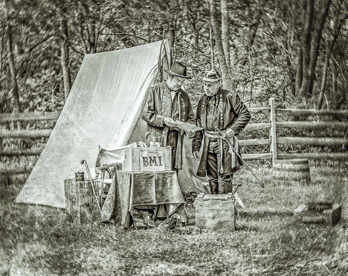 Major Sharpe (Rich Hill) of the Bureau of Military Intelligence confers with Major Meigs (Rob Meyer).