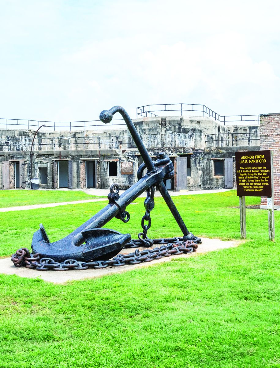 Interior view of Fort Gaines in 2017. The anchor from the USS Hartford is located in the fort. The sign reads: “Anchor from U.S.S. Hartford. This anchor came from the U.S.S. Hartford, Admiral Farragut’s flagship during the Civil War “Battle of Mobile Bay” in August of 1864. It was there that he uttered the now famous words, “Damn the Torpedoes – Full Speed Ahead.”