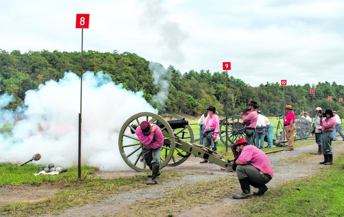 In a roar of smoke and recoil, 3rd Maryland Artillery fires their reproduction of the Austrian 24-pounder field howitzer. They placed 3rd in the howitzer match with a score of 47-3V.