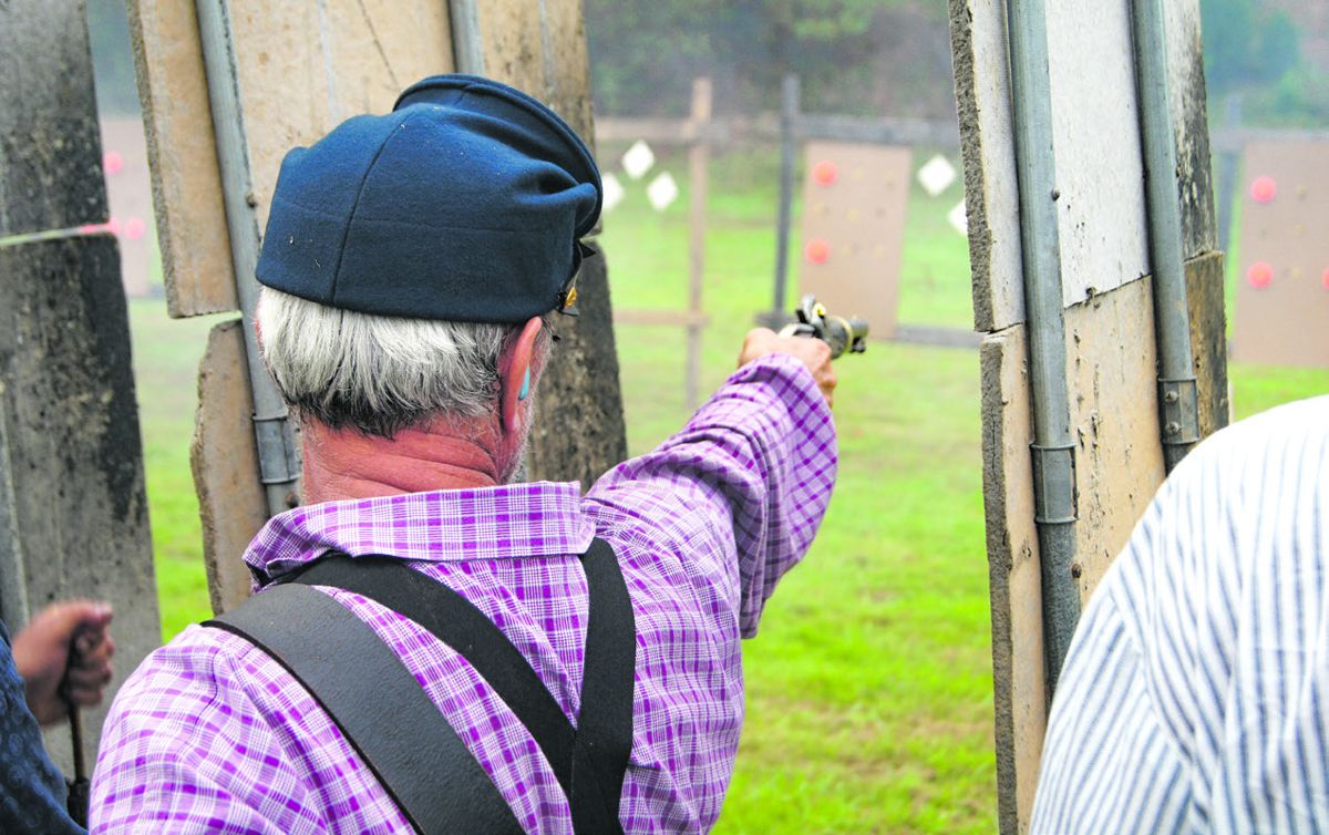 John Mark of the 29th Wisconsin takes careful aim with his M1842 Aston contract model single-shot pistol. (Bruce Miller)