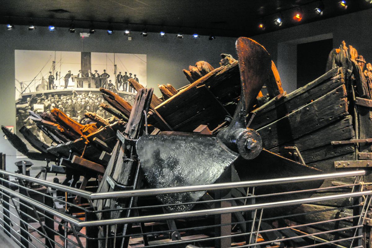 Remains of the CSS Chattahoochee with a photo in the background of the ship.