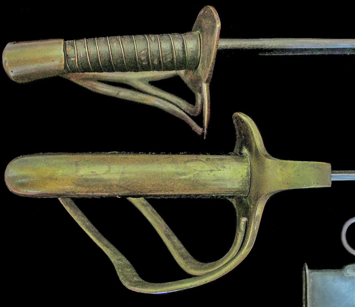A comparison of this massive sword’s hilt beside that of a full sized Kenansville sabre.