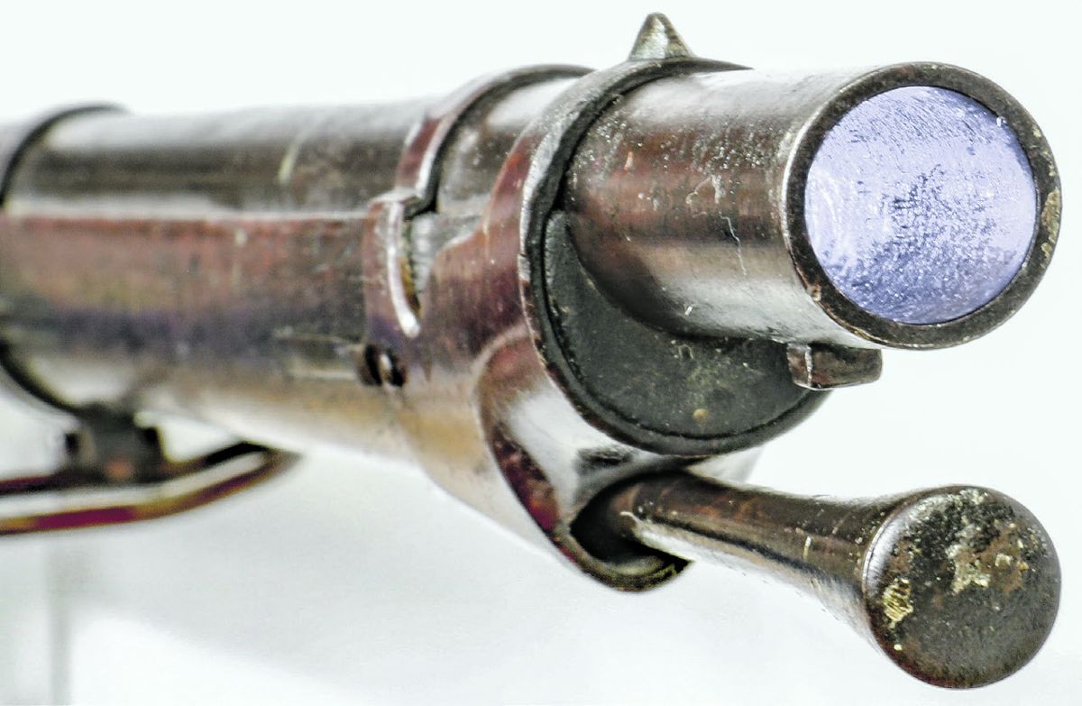 Muzzle area of a smoothbore M1851 Cadet, showing the smoothbore, original brass blade front sight and unaltered ramrod face.
