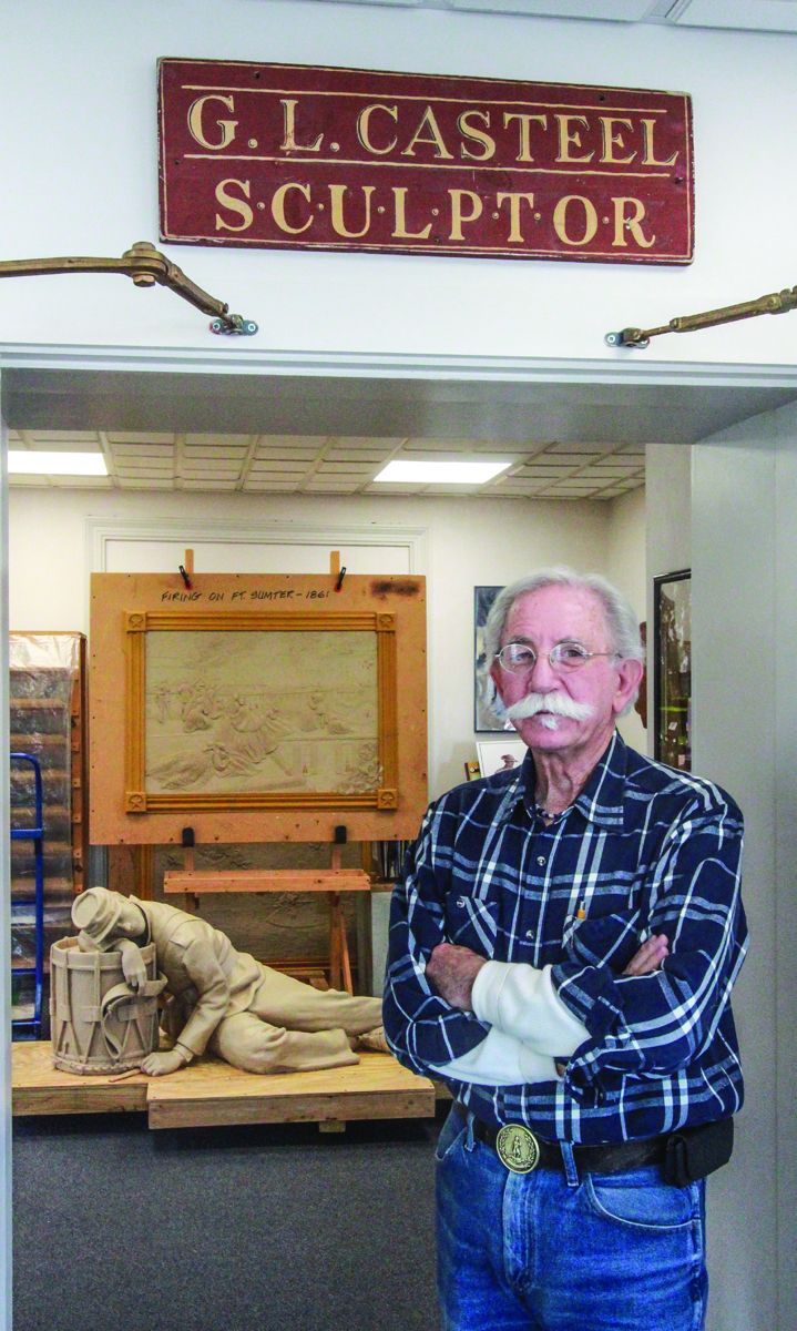 Gary Casteel with some of his work in the background.