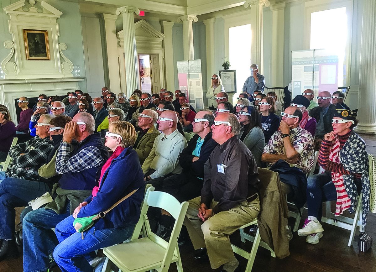 Attendees viewing the screen wearing their special 3-D glasses.