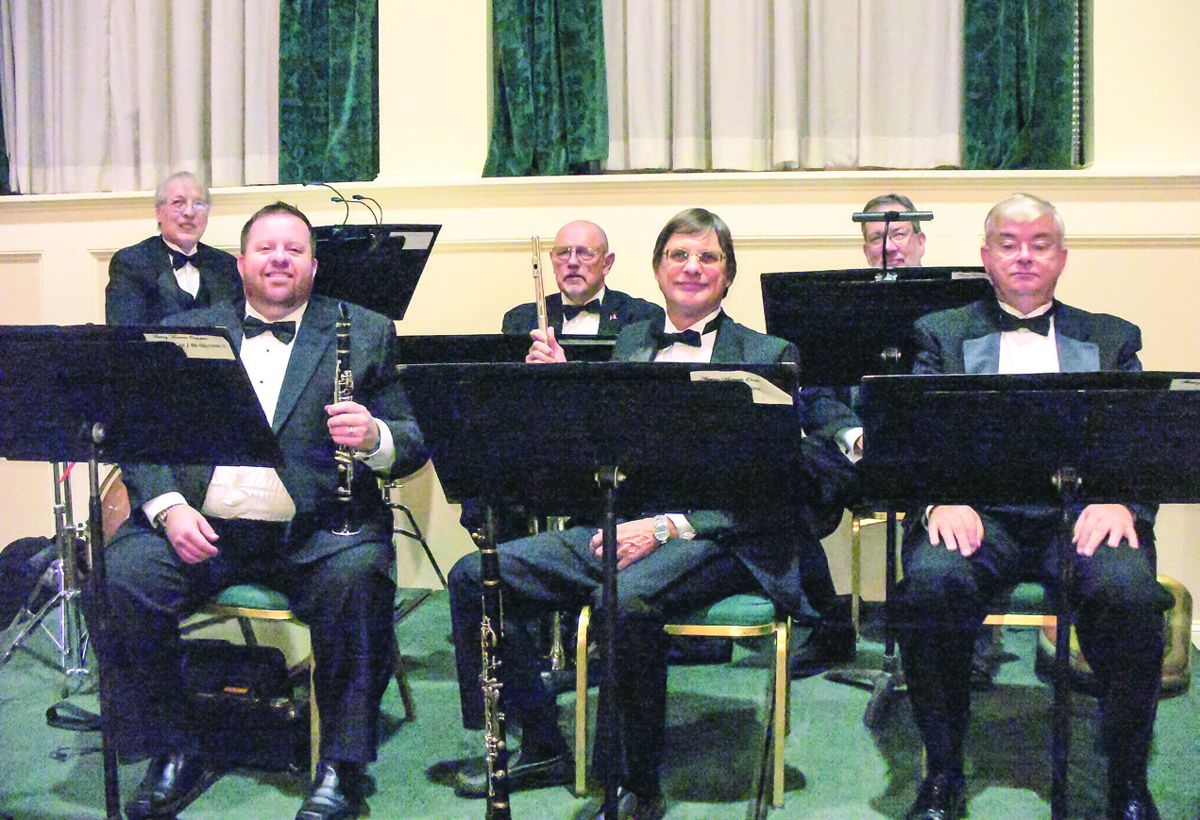 Members of the Fleeting Moments Waltz and Quickstep Orchestra take a break. Their music was very well received by (Photos by Joe Bordonaro)