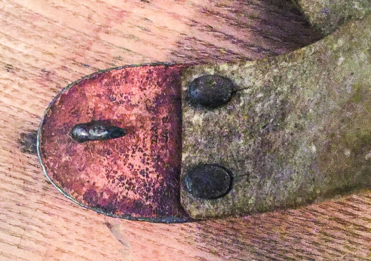 US oval studded belt buckle with leather protector on reverse and stamped with the makers name.