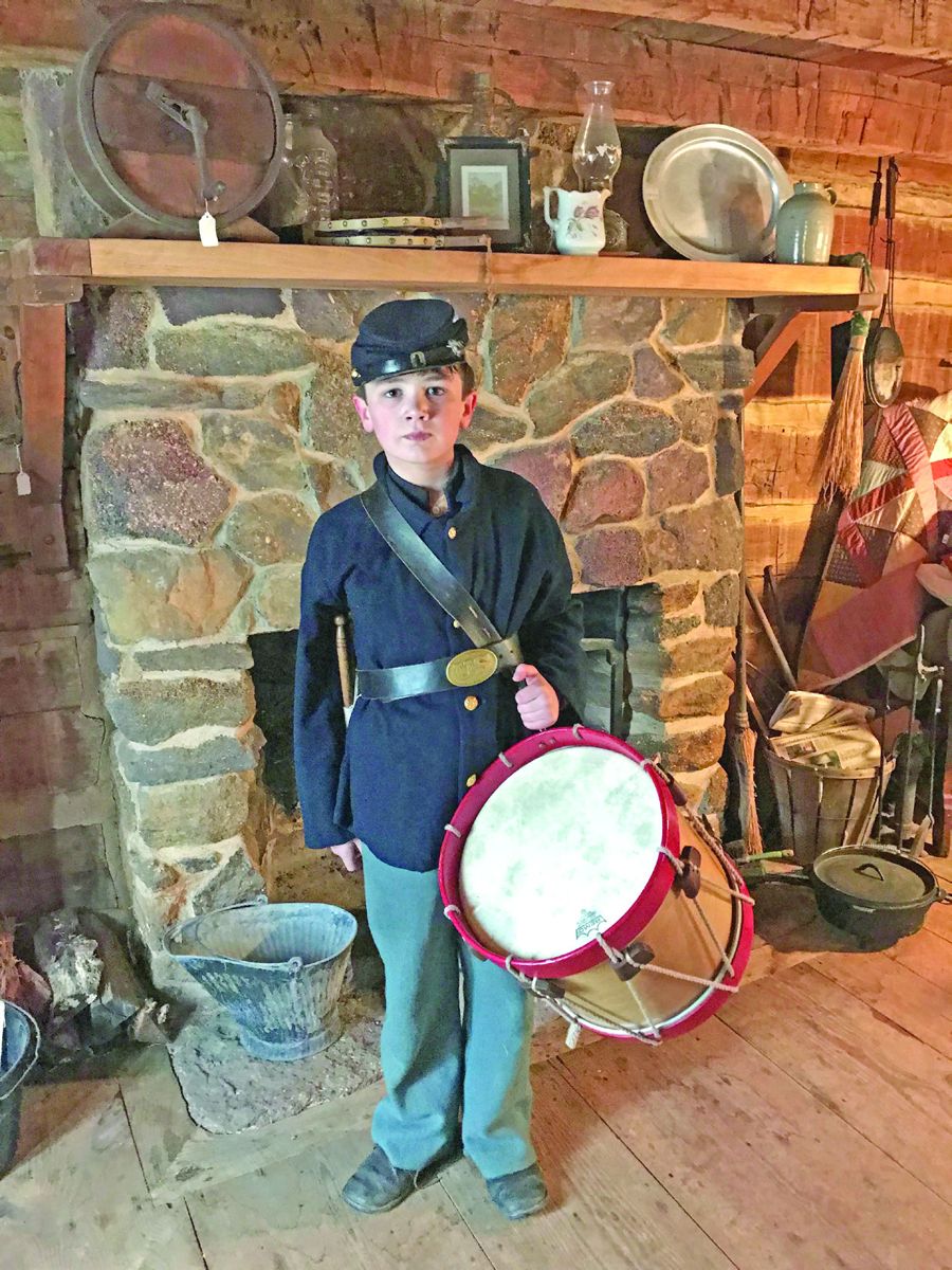 Chris Neff, age 10, son of Phil and Tina Neff, stands inside the Lower Alloway Creek Historical Museum in Salem, N.J. Chris has been playing the drums for four years. Phil is a military member of the 12th NJ, Co, K, and Tina is a civilian member. She also takes most of the photos for the group. The 12th NJ was performing a living history for the museum on April 15.