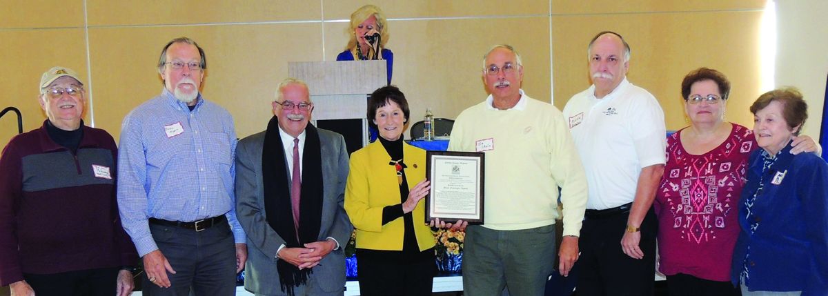 Several of the Project Committee Receiving the Award. (Left to right and their book responsibilities) Brian McEnany (co-chair), Blake Myers, Gerald Connolly (U.S. Representative 11th District, Va.), Sharon Bulova (Chairman of the Fairfax County Board of Supervisors), Jim Lewis (co- chair, project manager, and receiving the award), Mark Knowles (editing), Nadine Mironchuk (publisher), Nancy Anwyll (president bios).
