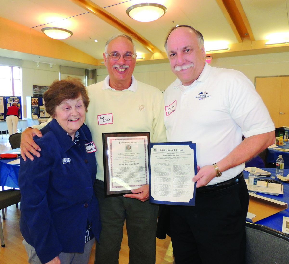 The Award and Congressional Record Entry. (Left to right) Nancy Anwyll, Jim Lewis, and Mark Knowles.