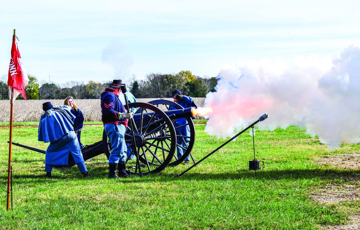 One of the students pulls the lanyard firing the gun of Stribling’s Battery.