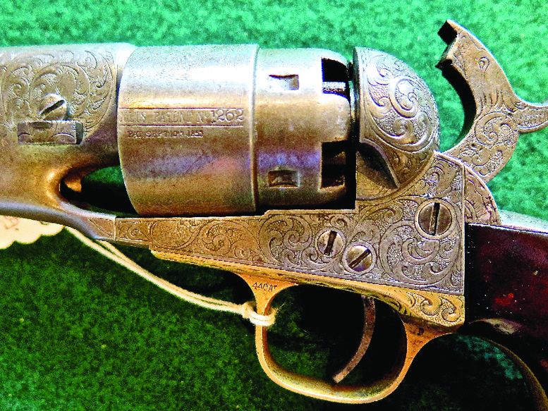Note both guns engraved (above two photographs) with similar design with punch dot backgrounds and “E” denoting factory engraving. Serial number 120185 is the top revolver.