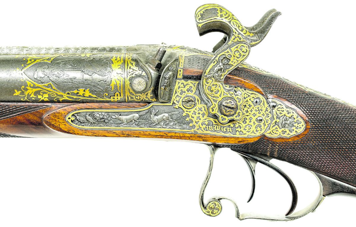 Reverse lock of the shotgun showing the ornate decoration of the lock and breech.