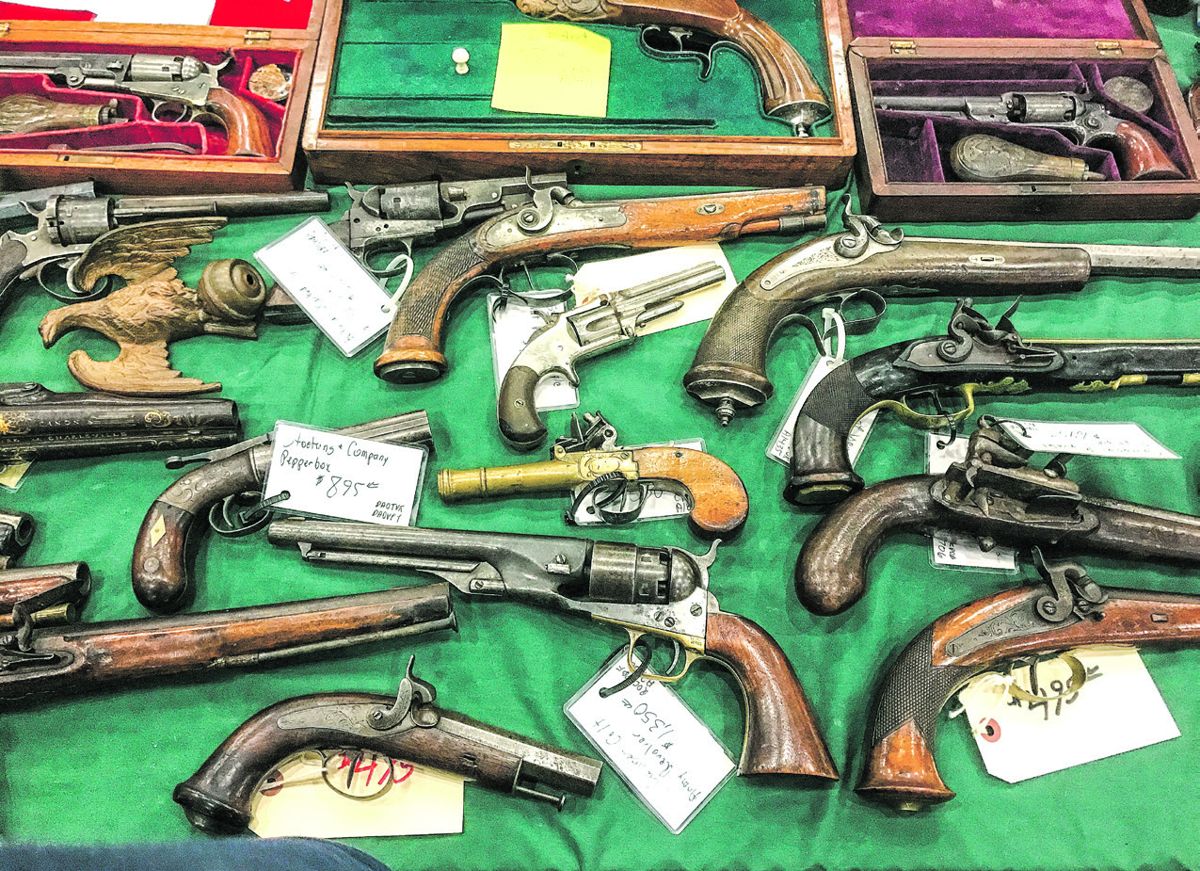 This array of pistols was typical of the items for sale.