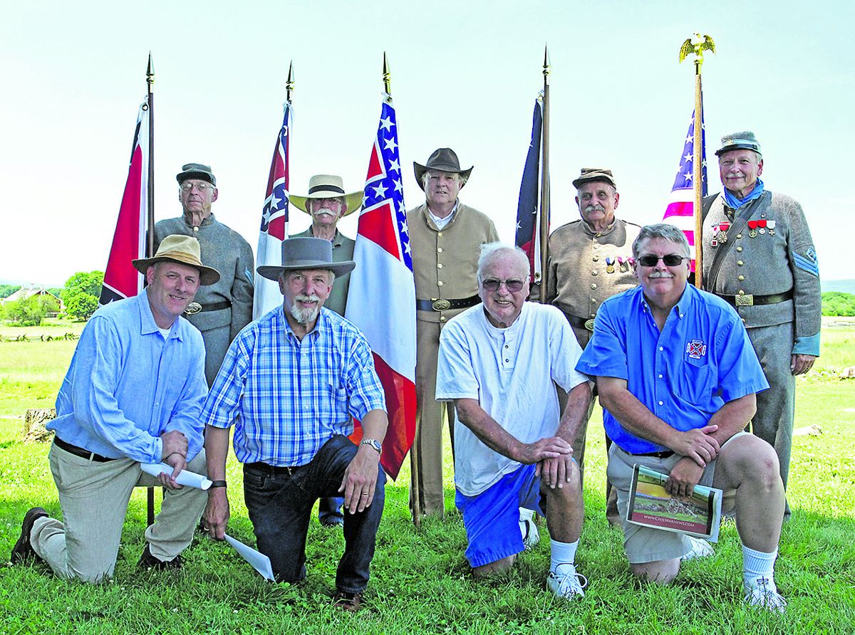 Kemper Color Guard. Left to right are Bob Doerr, Camp Commander Gary Casteel, Ron Short, Chaplain Rich Majewski, and Lieutenant Commander James Palmisano. Kneeling, left to right, are James Whitehead V, James Whitehead IV, Carl Sell, (Gwen Wyttenbach)