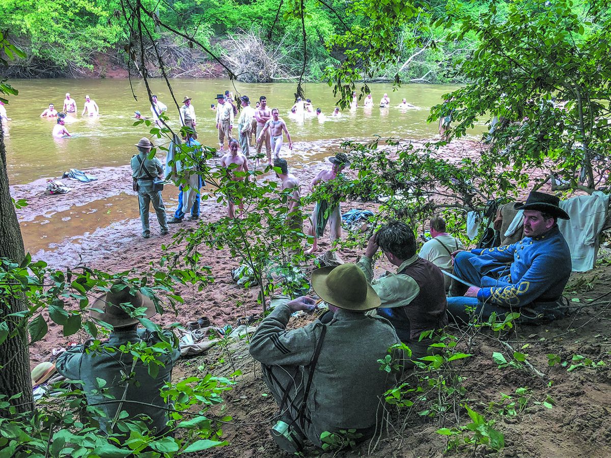 Reenactors cool off in the Hazel River on Culpeper County’s Brandy Station battlefield.