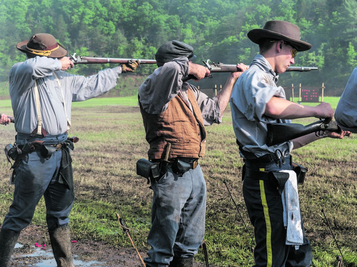 9th Virginia Cavalry, CSA is one of 142 musket teams who competed in this Spring’s National rifle-musket match. Here, two team members deftly aim their muskets while a third places a percussion cap on his gun.
