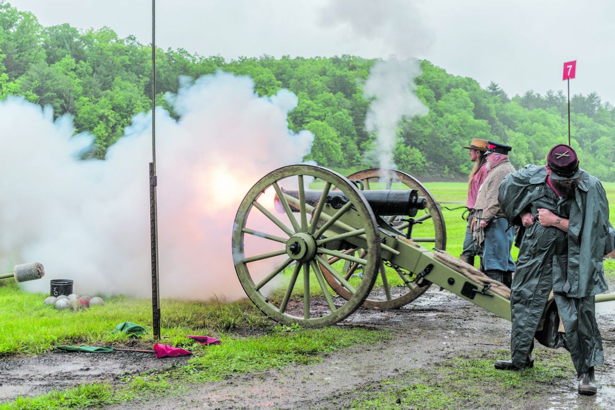 3rd Maryland Artillery fires their reproduction of the Austrian 24 pounder Field Howitzer in the rainy afternoon artillery match.