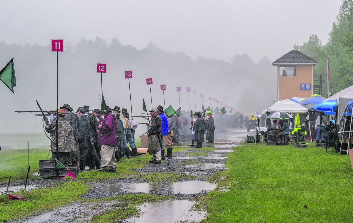 Looking down the firing line during the Smoothbore musket competition, toward the main Fort Shenandoah range tower. Each firing position has a safety officer and a timer to monitor the progress and safety of each event. (Tambi Dudley, Courtesy of Schuetzen Powder Energetics)