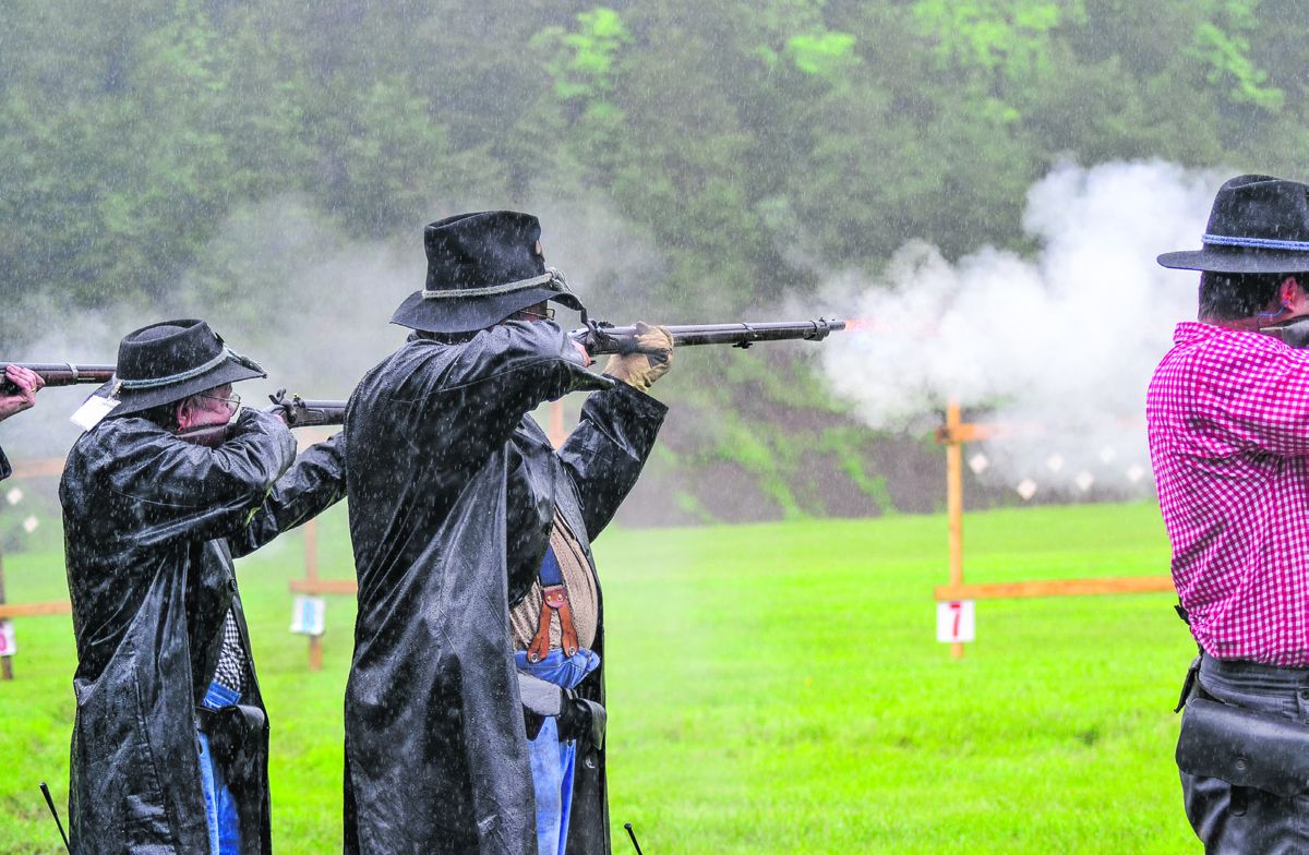 The Smoothbore musket events have seen a great increase in popularity among N-SSA members. 102 teams, including the 1st Michigan Infantry pictured here, competed in this rain- soaked match of four events at 25 and 50 yards. (Tambi Dudley, Courtesy of Schuetzen Powder Energetics)