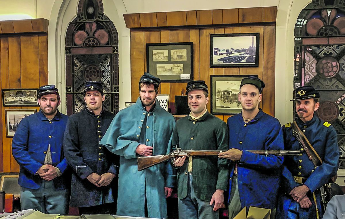 Colin Zimmerman and Dan Casella show an original rifle musket. (Katherine A. Peisochenske)