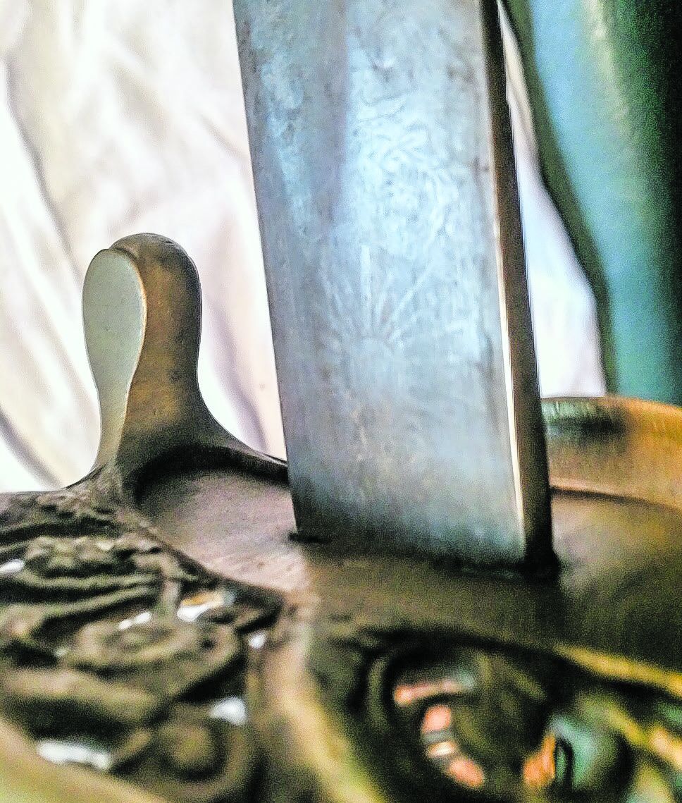 The “1” stamped on bottom of guard is an assembly number. The etched sunburst is near the ricasso on this side of the blade.