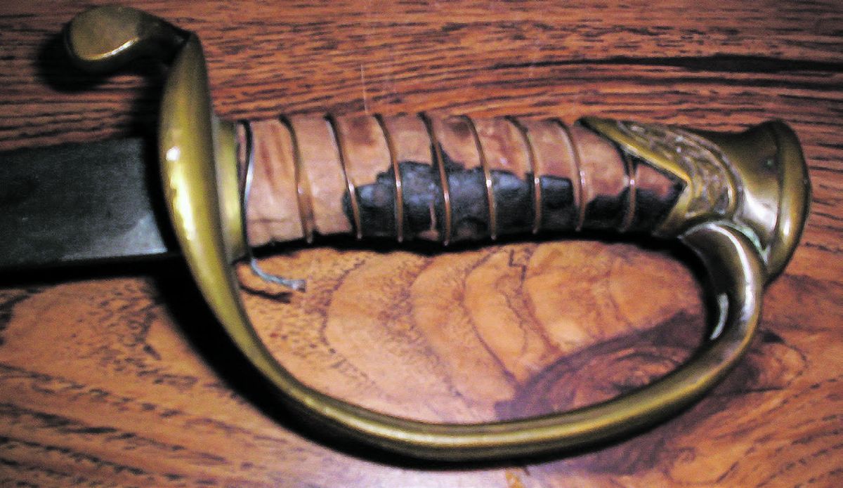 This hilt from a classic Boyle & Gamble foot officer’s sword still retains the original copper wire wrap though most of the leather