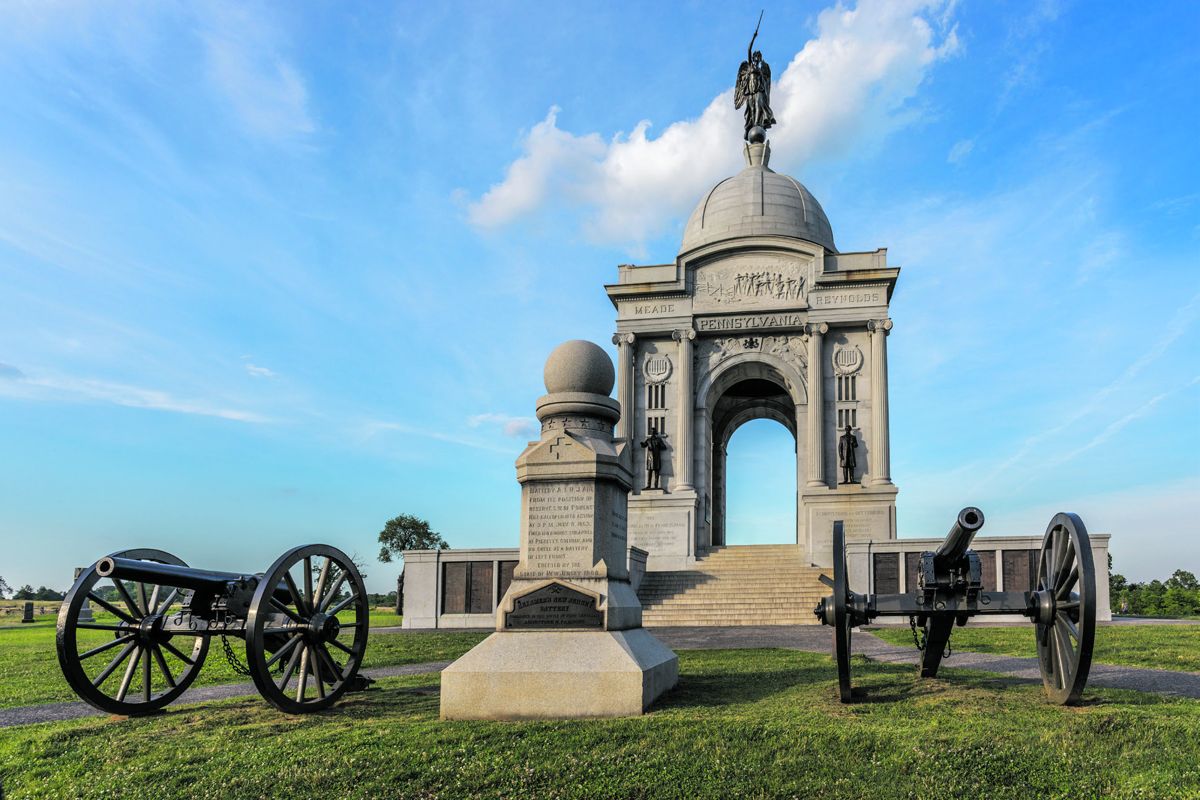The Pennsylvania monument, the largest at Gettysburg, is one of the most visited places on the battlefield. In the foreground is Hexamer’s New Jersey Battery’s monument with a U.S. 3-inch Parrott rifle (left) and a U.S. 10-pounder Parrott rifle (right).