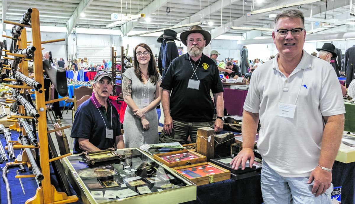 The Horse Soldier, located in Gettysburg, brought Gettysburg artifacts from old-time collections. Left to right: Don Bennett, Cara Stewart, Jim Young, and Wes Small.