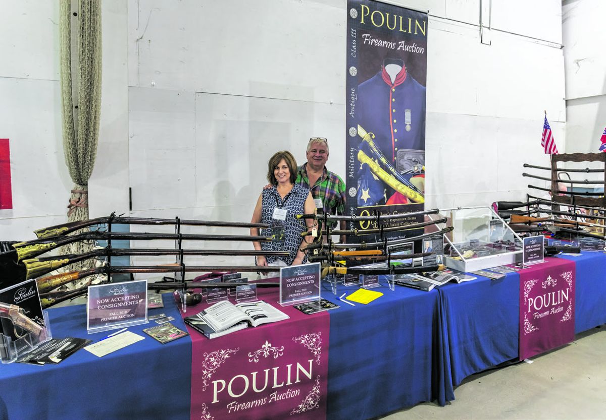 Deanna and Robert French of Poulin’s Firearms & Militaria Auctioneers, displayed weapons for their upcoming auction.