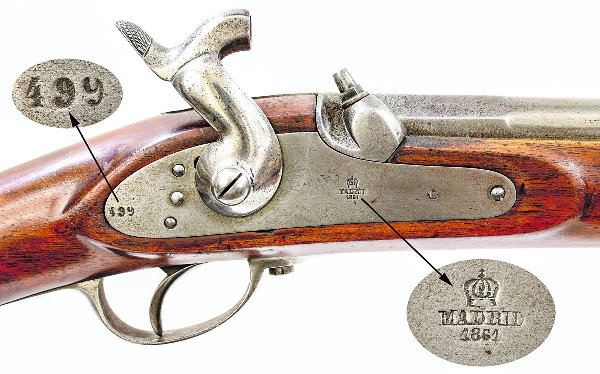 Close up view of the lock of Spanish M1857/59 rifle lock showing the Madrid/1861 lock markings and serial number 499.