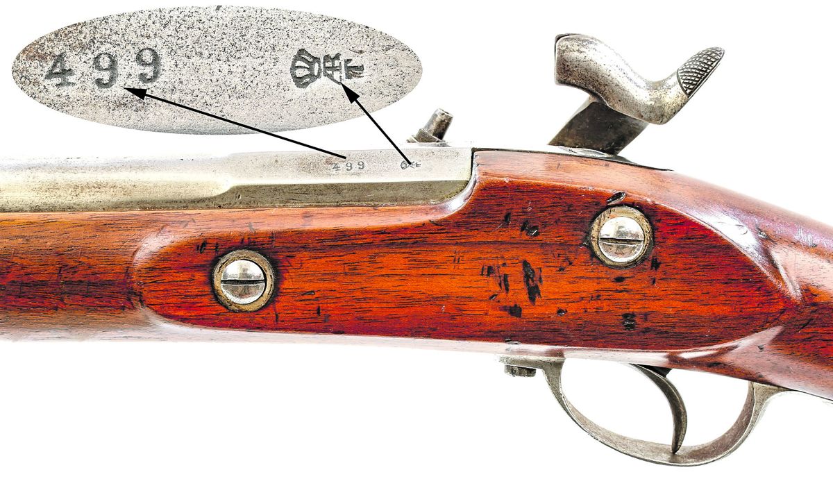 Close up view of the lock of Spanish M1857/59 rifle lock showing the Madrid/1861 lock markings