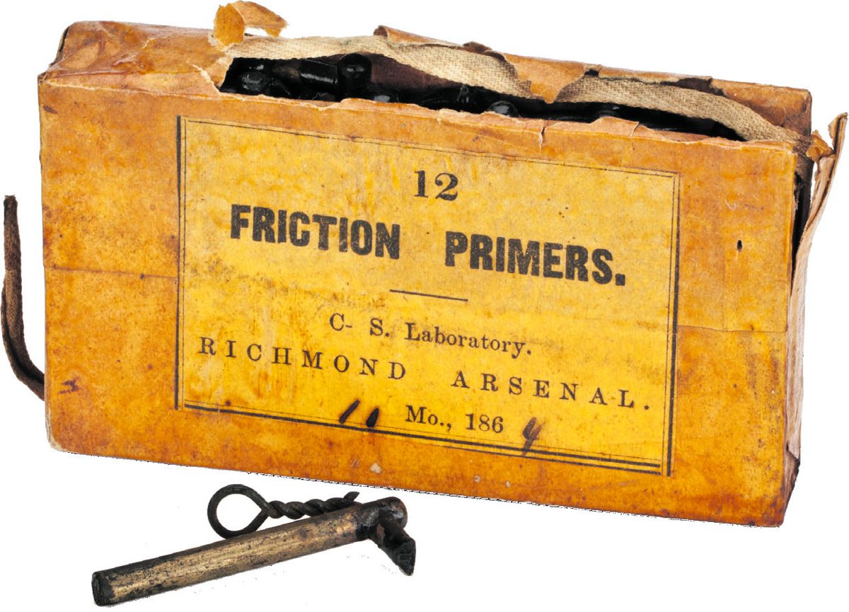 Paper wrapping is marked 12 / FRICTION PRIMERS. / C- S. Laboratory. / RICHMOND ARSENAL. / 11 Mo., 1864. Box is 4.13 inches wide x 2.34 inches high x .74-inch thick. Friction primer is .189-inch in diameter and is 1.83-inches long. There are six holes in the wooden box each containing two friction (Courtesy Atlanta History Center)