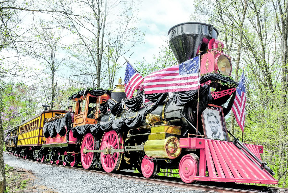 Lincoln Funeral Train moving down the tracks, with colors flying.