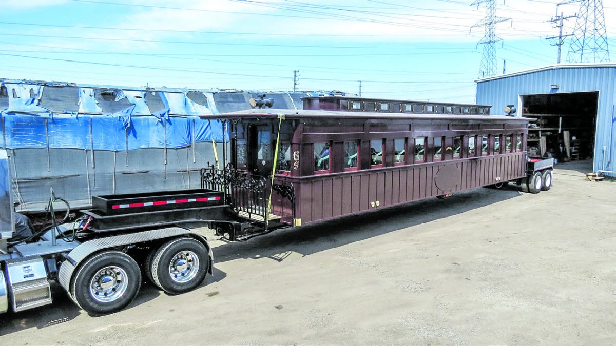 Hearse car being transported on a low-boy trailer. (Dave Kloke)